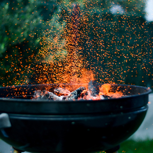 Flames on charcoal grill