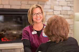 Infusion nurse with patient at the Cowell Family Cancer Center