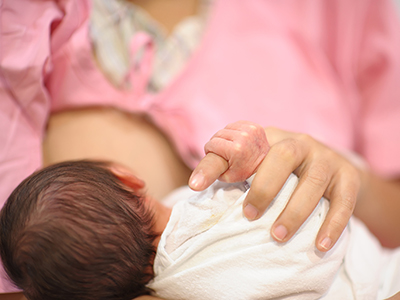 Infant at mother's breast