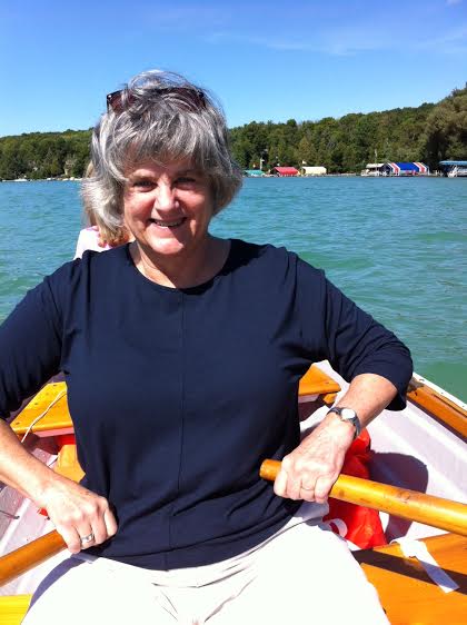 Woman rowing in boat