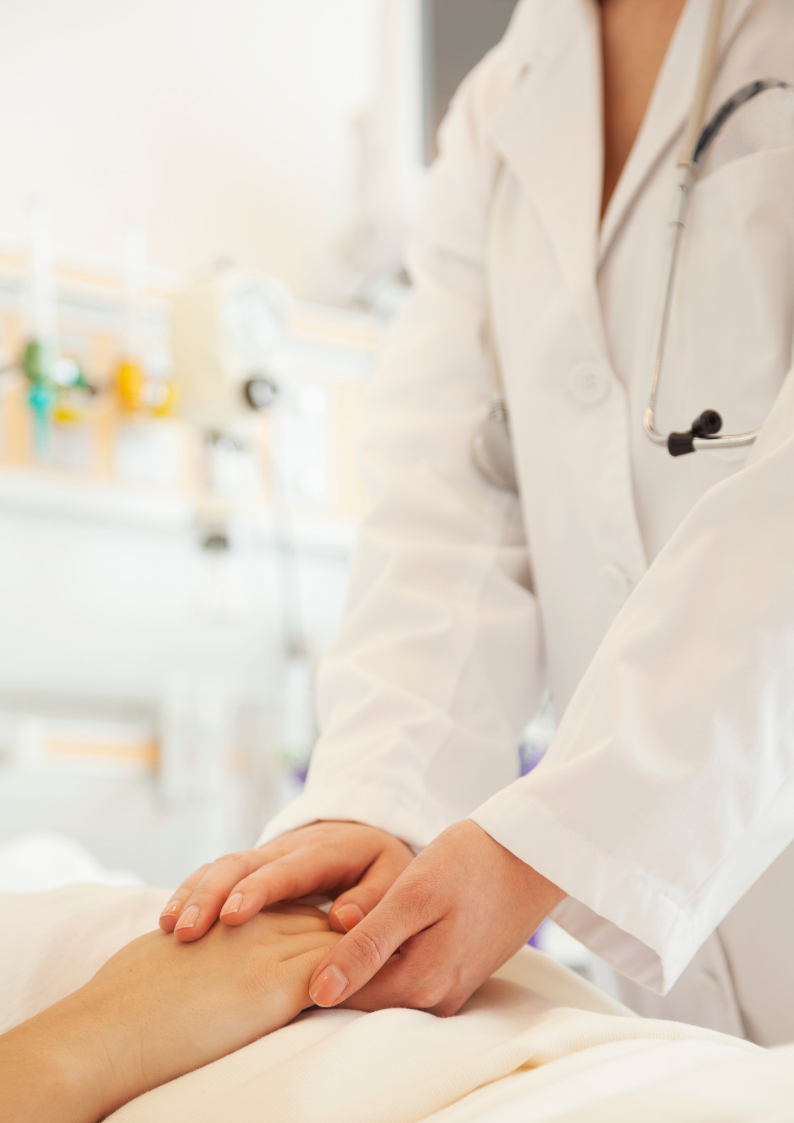 Doctor holding patient's hand