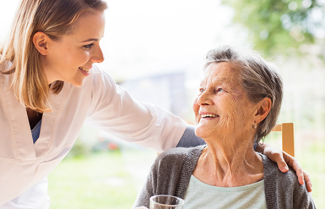 Woman with hand on shoulder of older woman