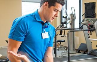 Photo of physical therapist in rehabilitation facility