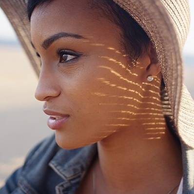 Young woman wearing sun hat