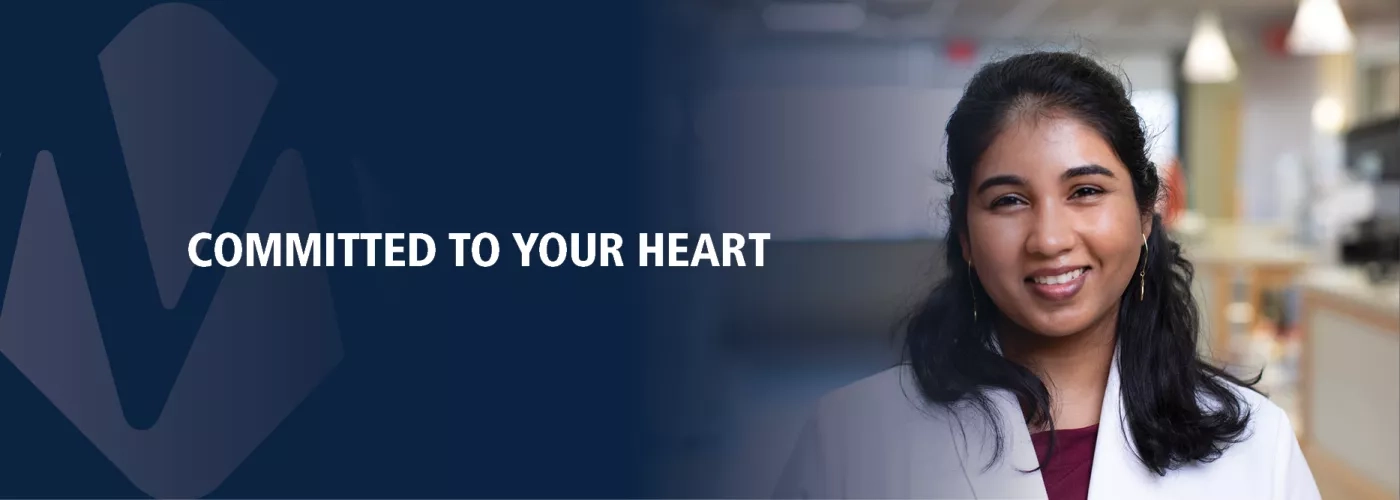 Female cardiologist; text reading "Committed to Your Heart"