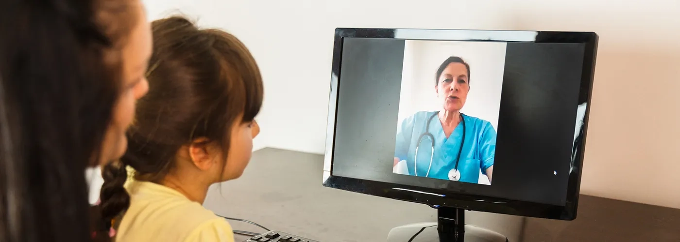 Woman and child on video call with healthcare provider