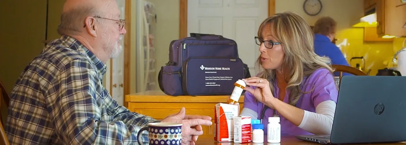 Home health provider meeting with patient at his home